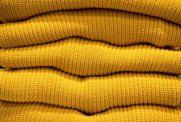 Handmade yellow knitting wool texture background