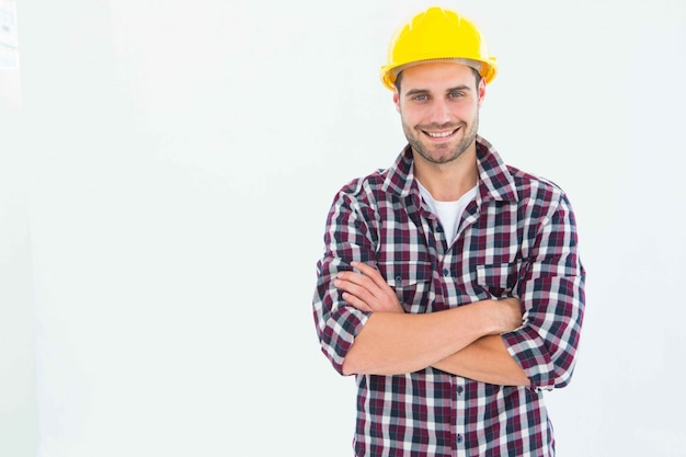 Handome male repairman standing arms crossed