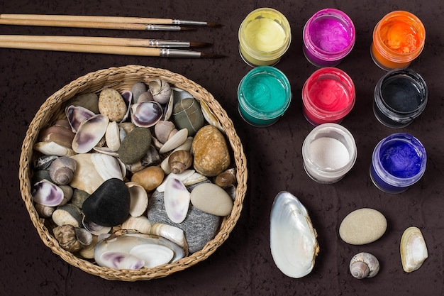 Handpainted dot patterns on sea pebbles and shells Step 1