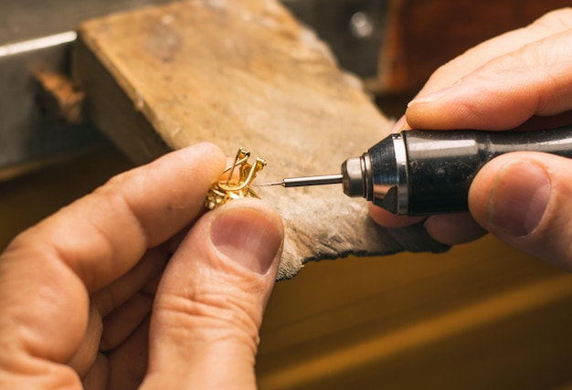 Hands Of An Artisan Jeweler Working Jewelry. Jewelry Goldsmith