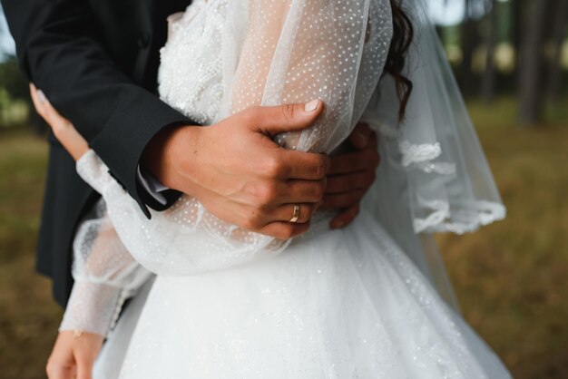 Hands of the bride and groom close-up