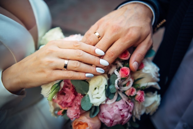 Hands of the bride and groom