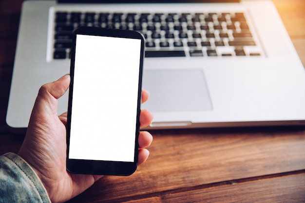 Hands business holding blank screen mobile in desk work.