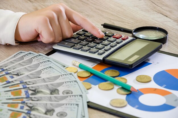 hands of a business woman on the background of business charts The concept of analysis   risk