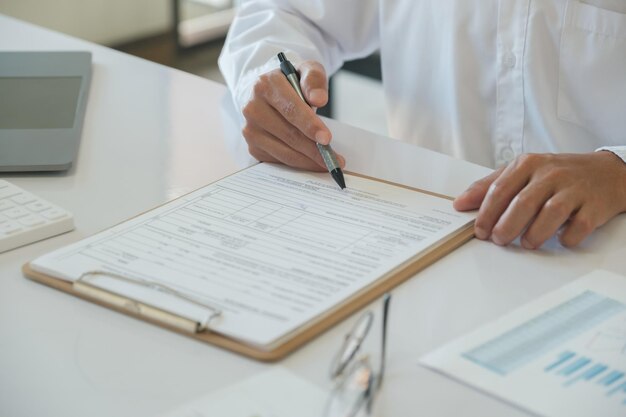 Hands of a businessman about to sign a business contract