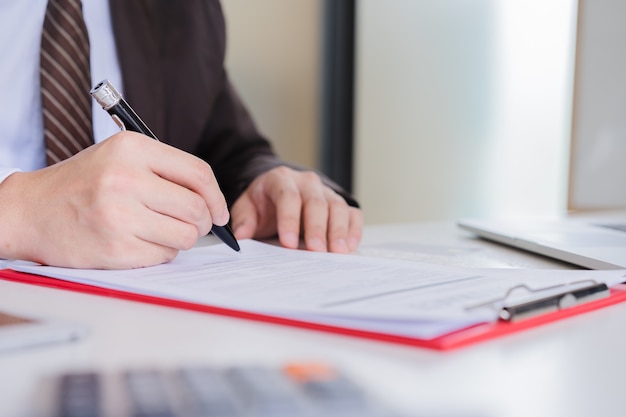 Hands of businessman brown suit 