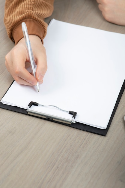 Hands of businessman working taking notes on office desk. 