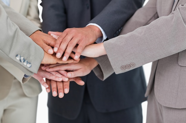 Hands of businesspeople together