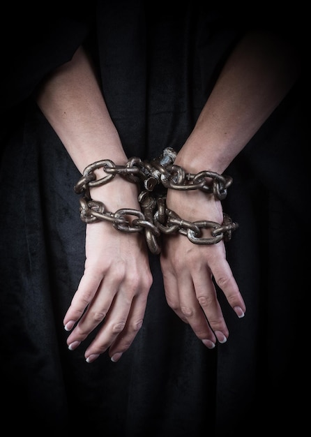 Premium Photo Hands In Chains Woman Prisoner Concept