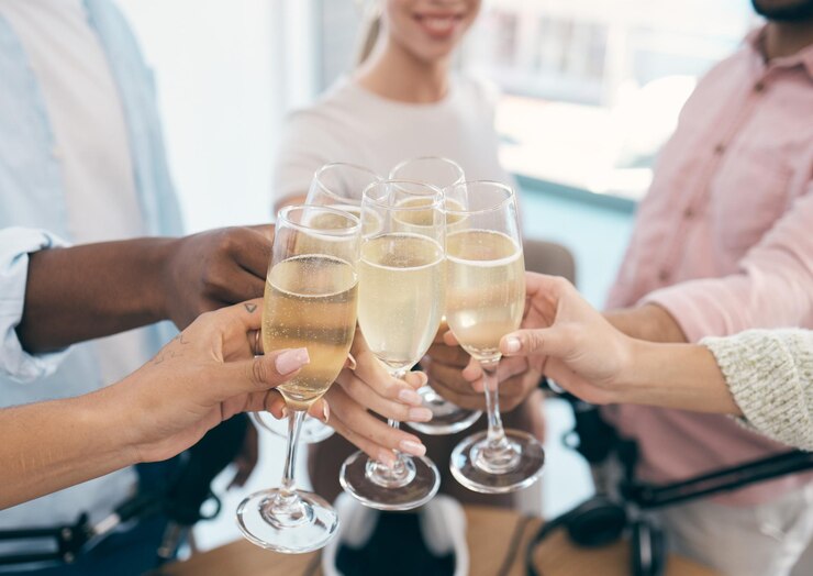 Photo hands champagne and toast with celebration and professional people in office with alcohol and success winning team and employees cheers with alcoholic drink closeup with partnership and pride