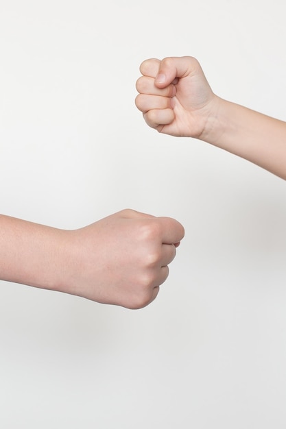 Photo the hands of a child and an adult on a white background people childhood gesture the concept of body parts