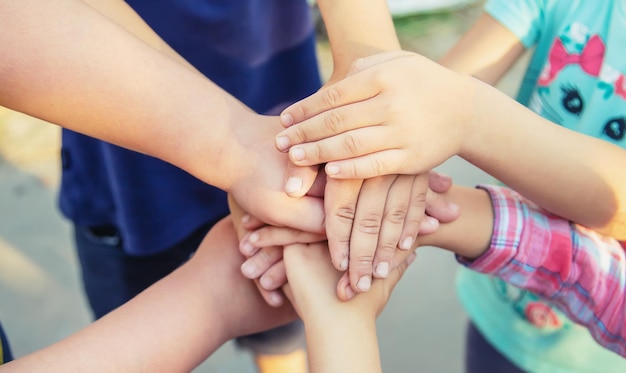 Hands of children many friends games Selective focus