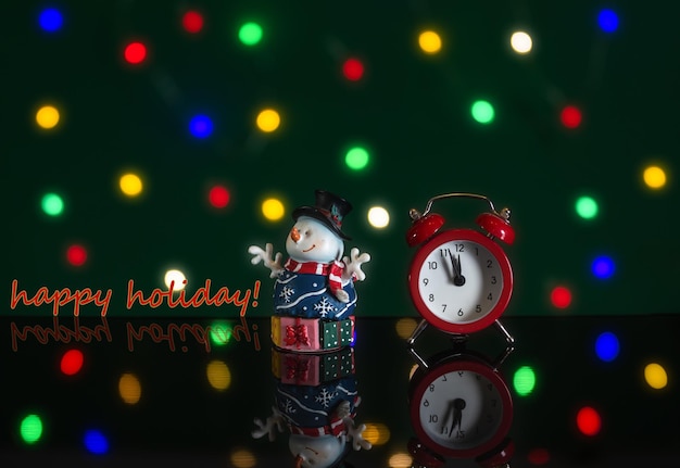 The hands of the clock measure the last minutes before the new\
year. happy holidays.