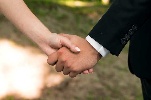 Hands closeup of a loving couple, romance, love