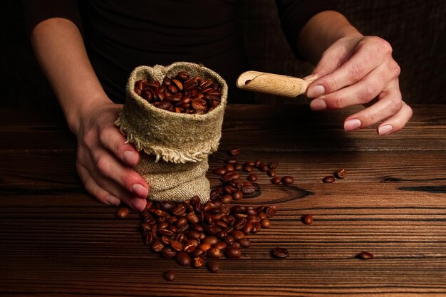 A hands and coffee grinder