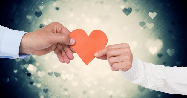 Hands of couple holding a heart