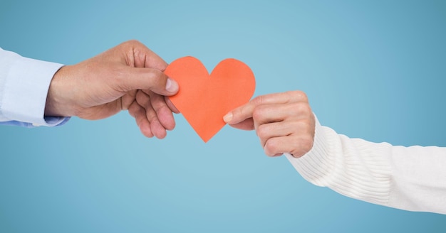 Hands of couple holding a heart