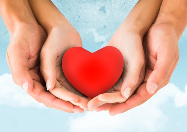 Hands of couple holding a heart