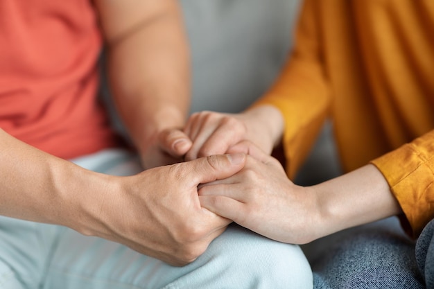 Hands of cuddling man and woman closeup shot