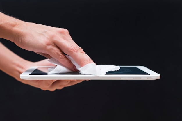 Photo hands disinfecting tablet