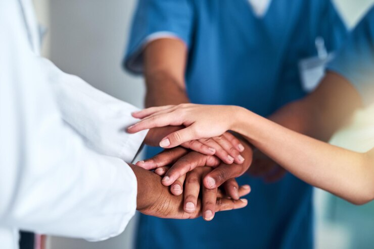 Photo hands diversity and teamwork medical support staff and healthcare with nurse and doctors colleagues collaboration and clinic for surgeon medicine and partnership for help and unity in medicare