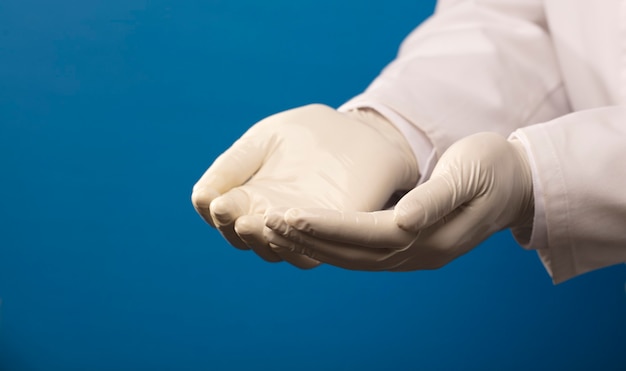 Photo hands of doctor with gloves gesture receive