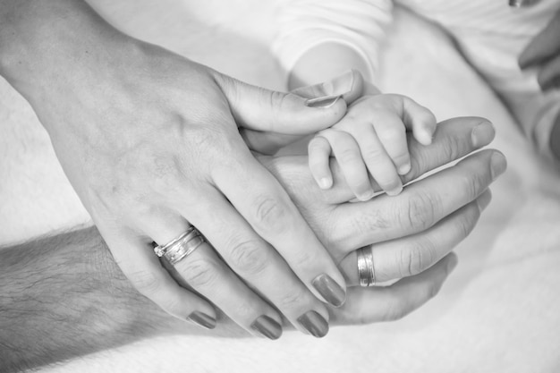 Hands of family together