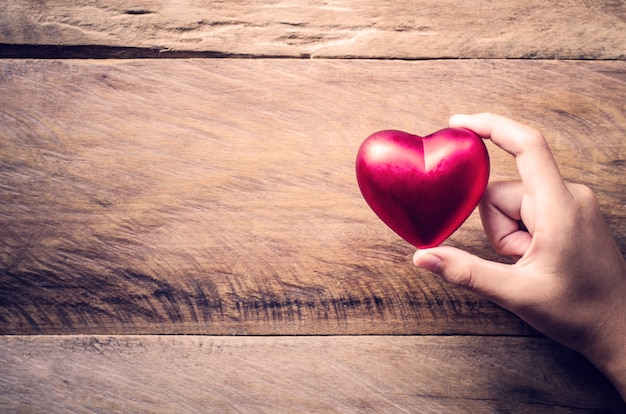 hands female giving red heart