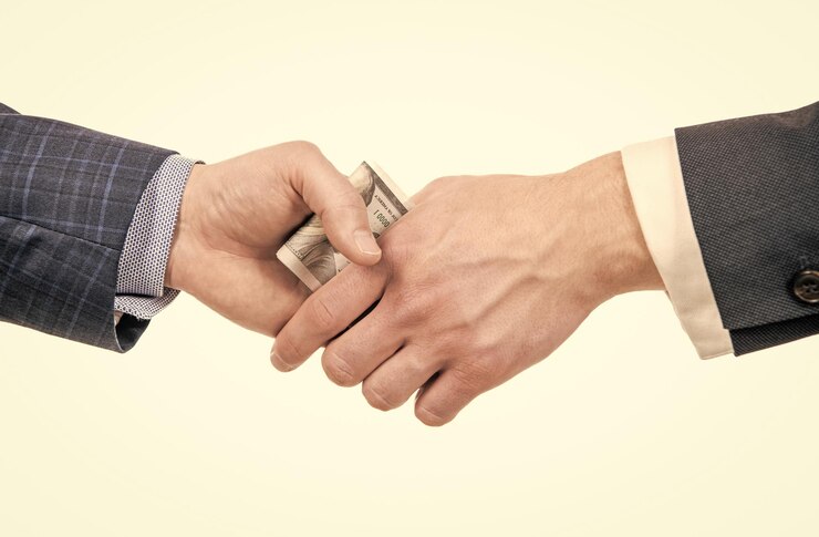 Photo hands giving money bribe or financial support corruption