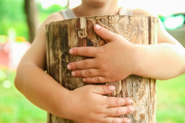 Hands of a happy child in nature