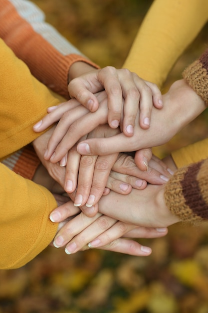 Hands held together on a natural background