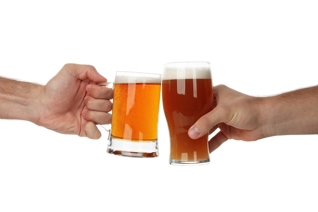 Hands hold glass of beer, isolated on white 