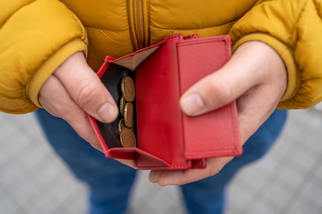 Hands hold wallet with money