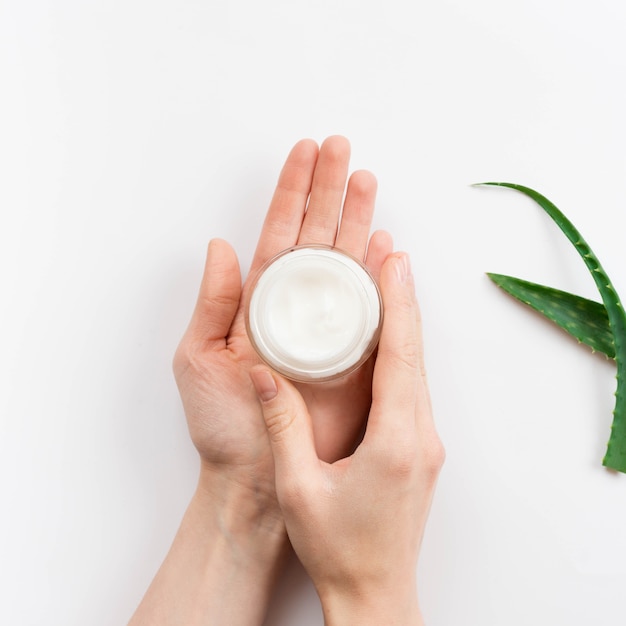 Hands holding body cream spa concept