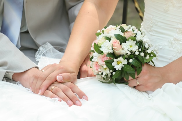 Hands holding and a bouquet