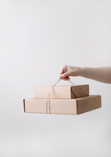 Hands holding cardboard boxes Online shopping and express delivery concept