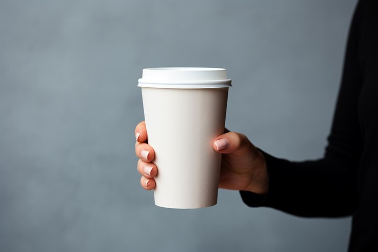 Hands holding coffee cup mockup