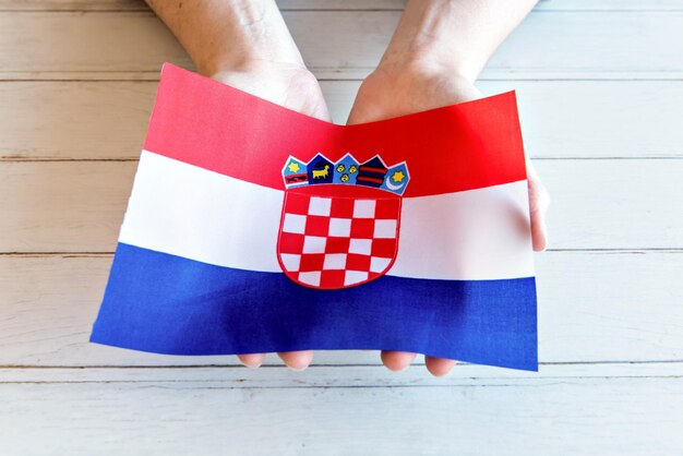 Hands holding the Croatian flag