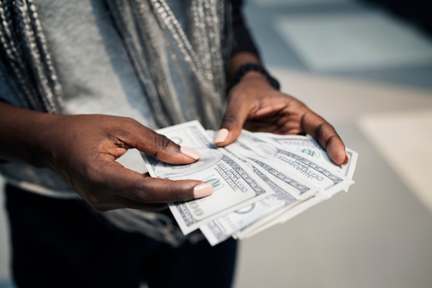 Hands holding a dollar bills