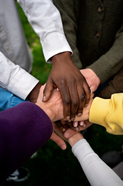 Photo hands holding each other for support