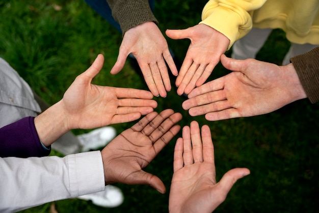 Photo hands holding each other for support