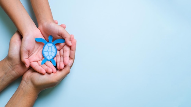 Hands holding earth globe world environment day world earth day world ocean day concept