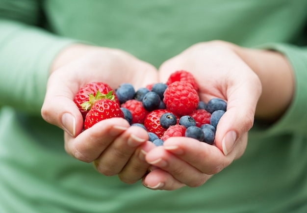 Hands holding fresh berries