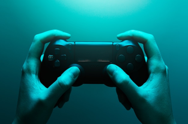 Photo hands holding a gamepad