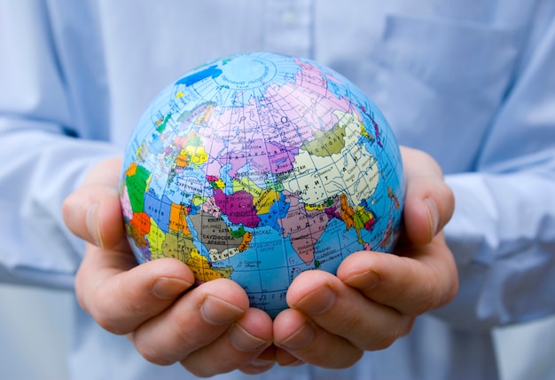 hands holding a globe earth