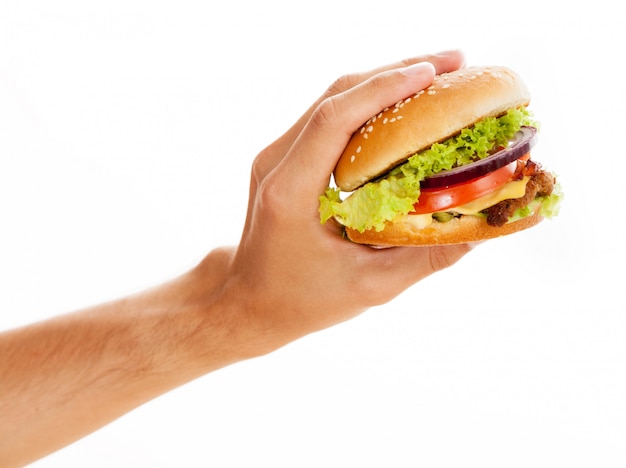 Photo hands holding a hamburger