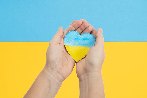 Hands holding heart of Ukraine