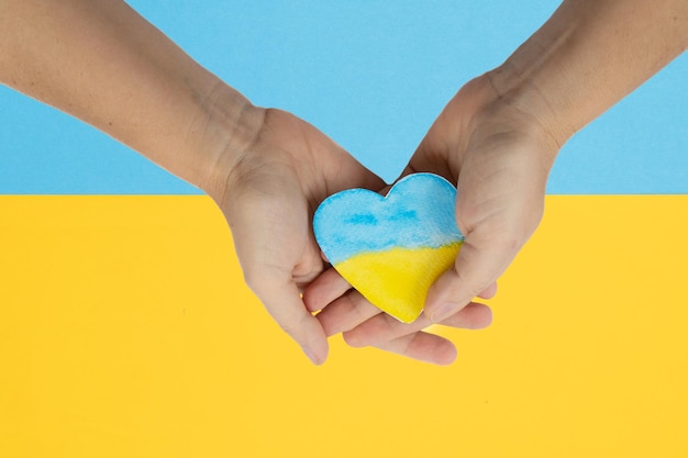 Hands holding heart of Ukraine