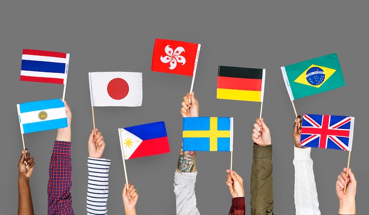 Photo hands holding international flags
