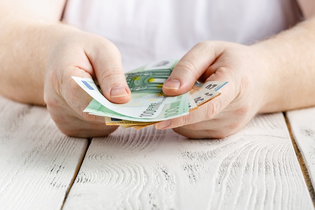 Hands holding a lot of money banknotes